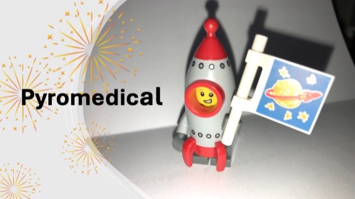 A toy rocket with a smiling face and red details sits next to a small flag showing a planet, with Pyromedical text and golden firework graphics overlay.