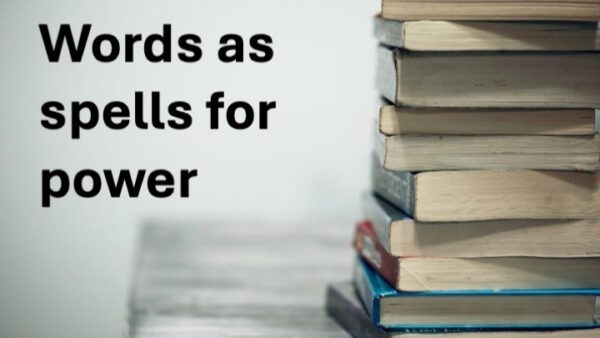 Stack of books with text Words as spells for power overlaid on white background
